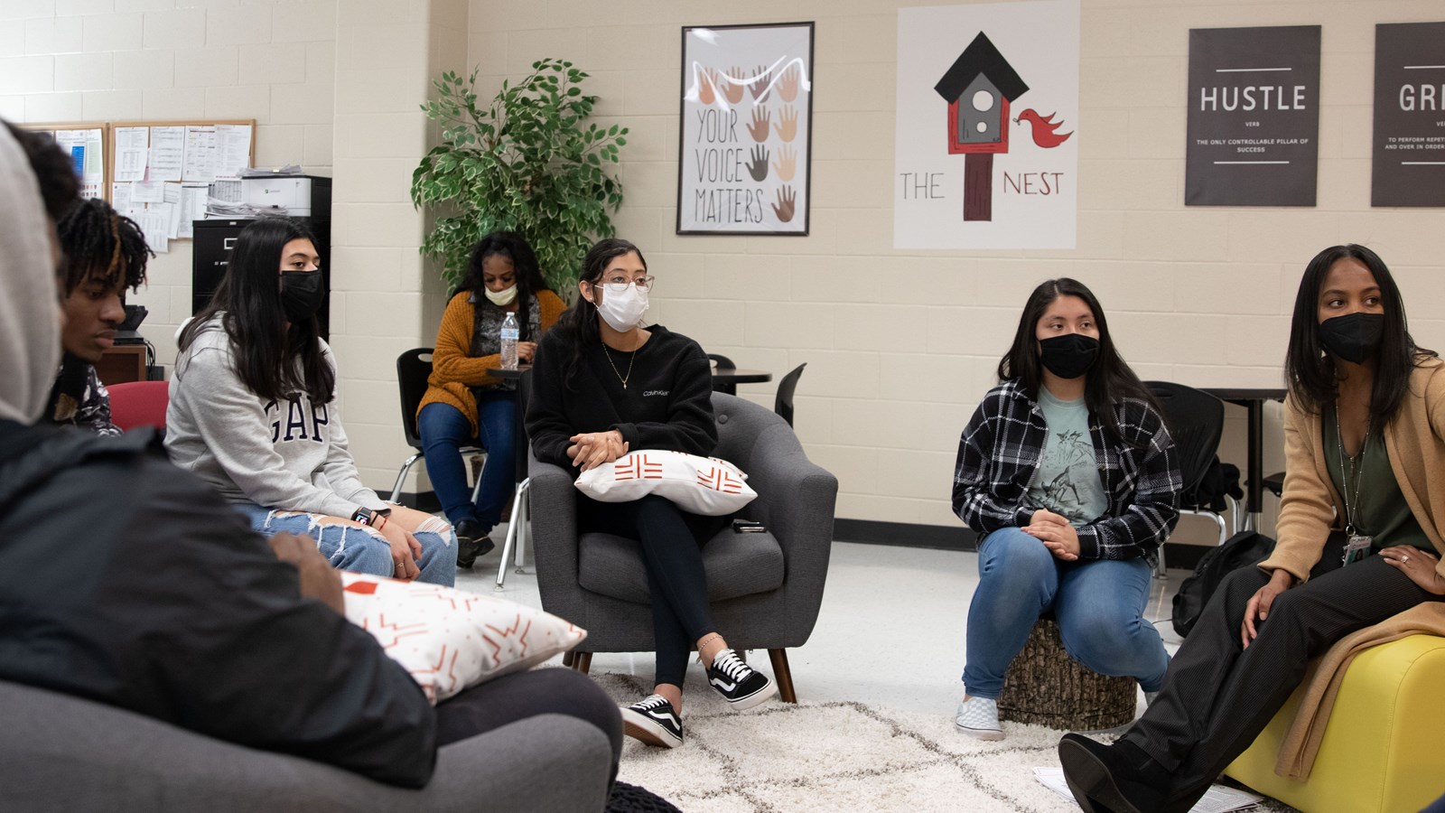 Tinesha Dunlap works with students on the advisory council for Osborne High School's The Nest